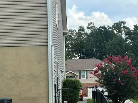 Oversized 3x4 downspout carrying runoff away from a Chattanooga foundation