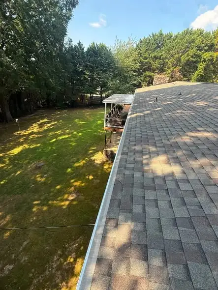 White seamless gutter run along a Chattanooga roof edge